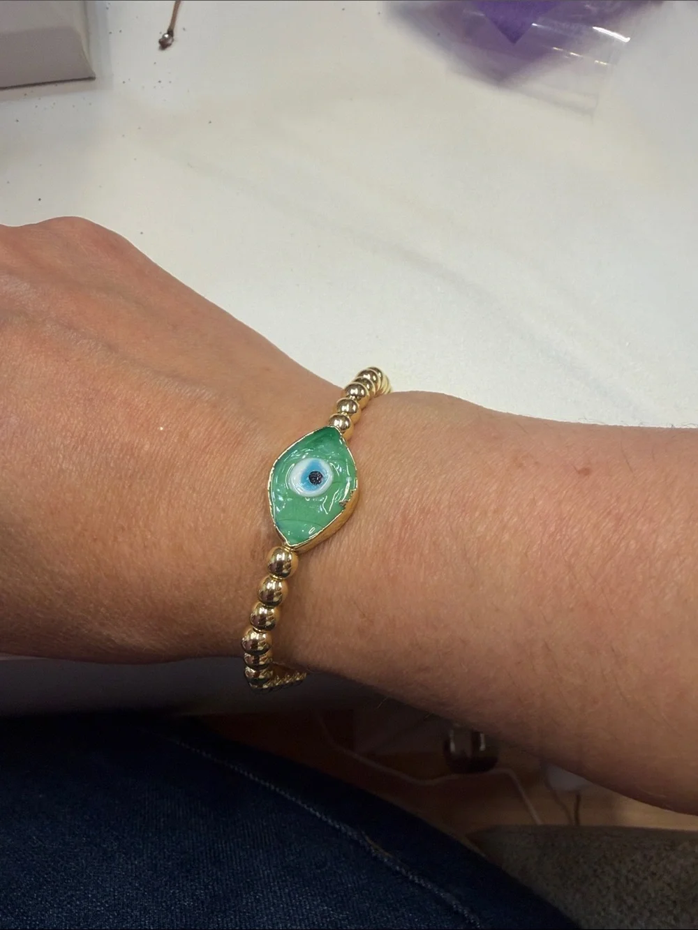 Gold Beaded Bracelet with Green Evil Eye Charm